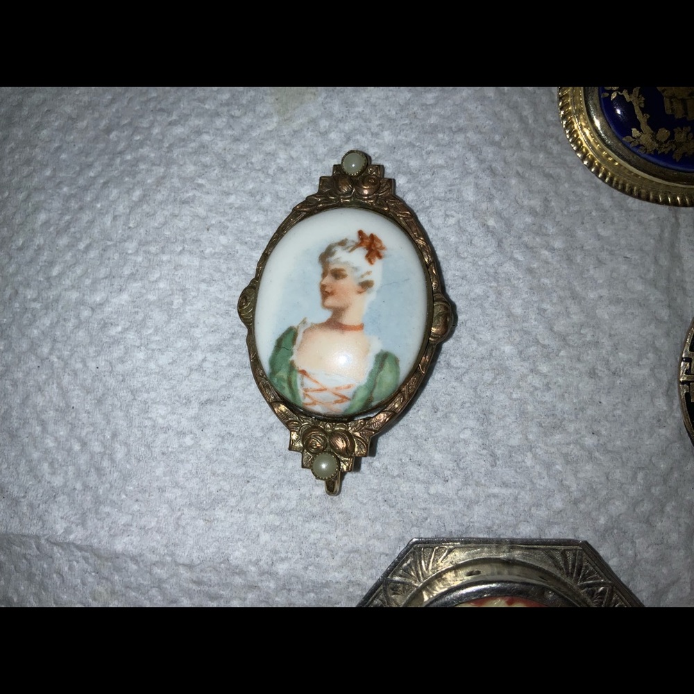 Vintage porcelain cameo of woman 1 1/4 by 2 inches